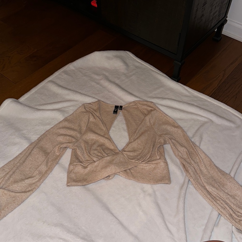 Cute fall sweater with an open back, ties into a bow!